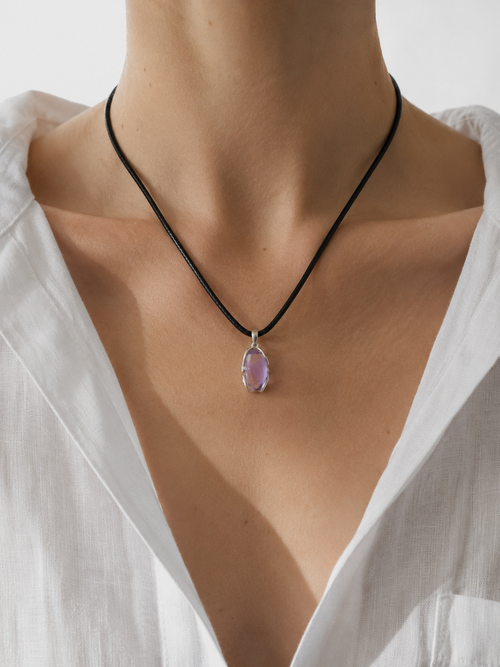 Woman wearing the VeilBond Quiet Harbor amethyst necklace