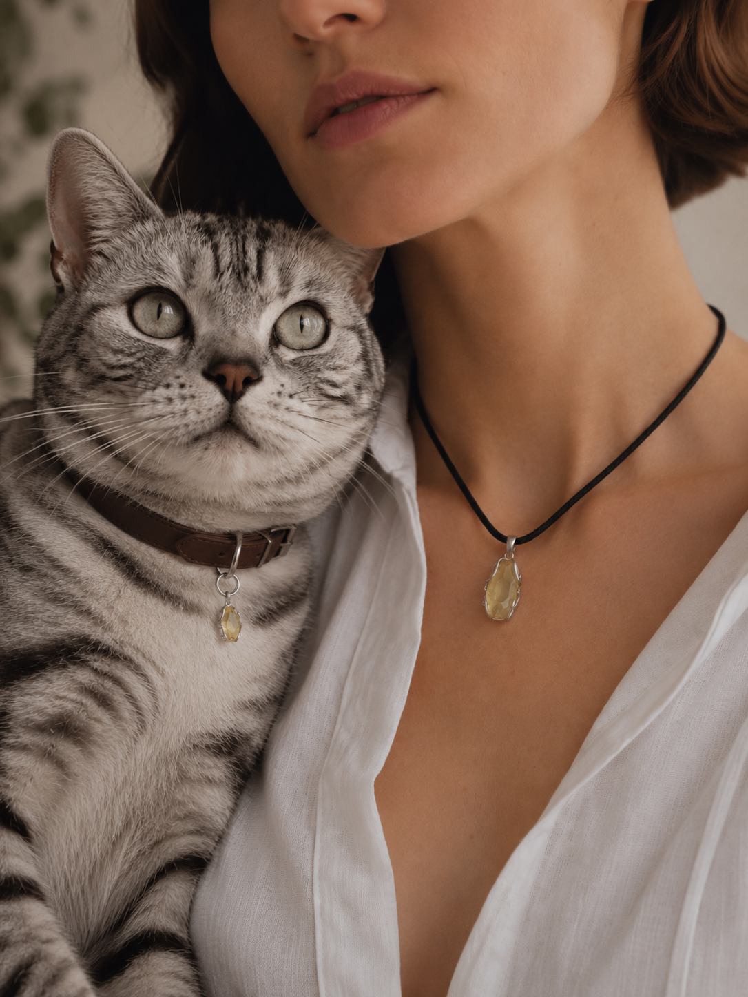 Woman and dog wearing matching VeilBond citrine pieces outdoors