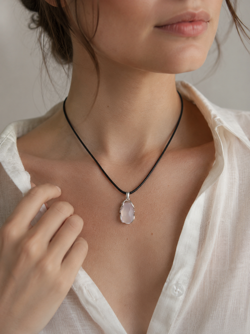 Woman wearing the VeilBond Tender Thread rose quartz necklace